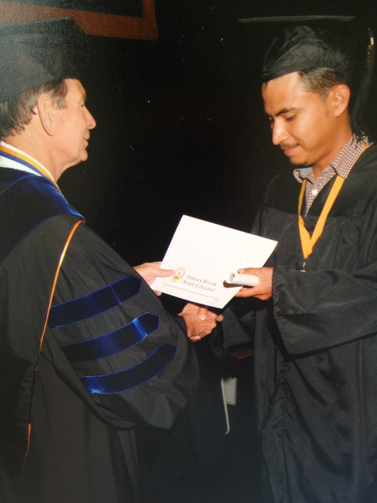 Edwin R. Massey, Ph.D. presenting a diploma to Samuel Villa 2014 Scholarship winner